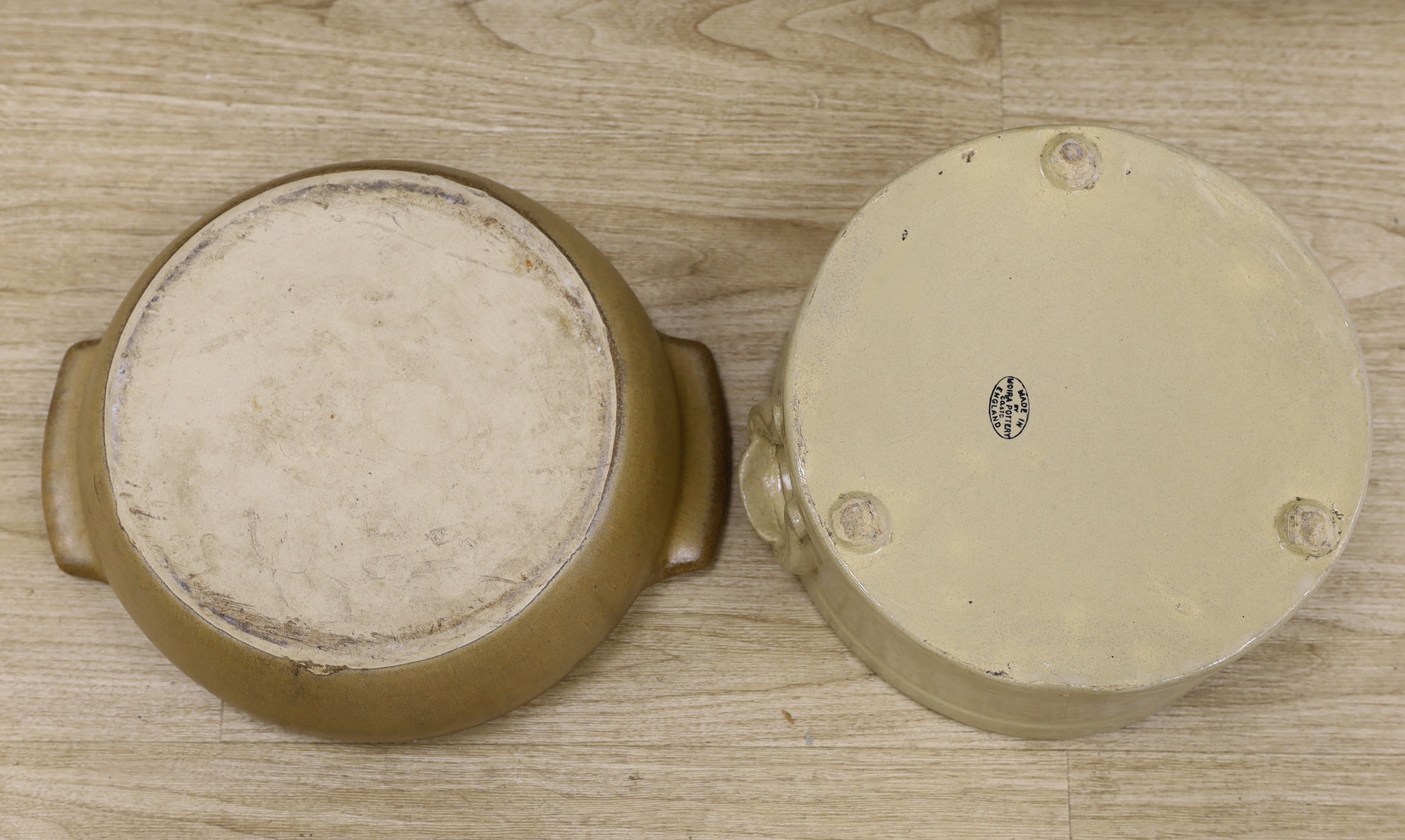 Two circular stoneware bowls including a Moira Pottery example with stamp to the base, the largest 38cm wide